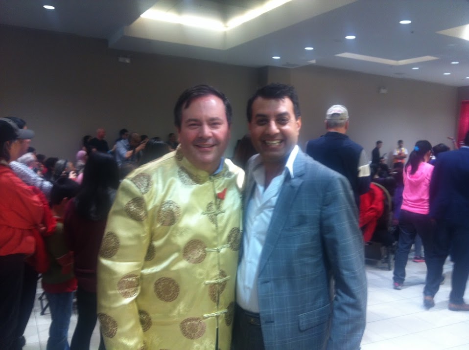 Aditya Tawatia with Defense Minister Jason Kenney during an event in Surrey BC